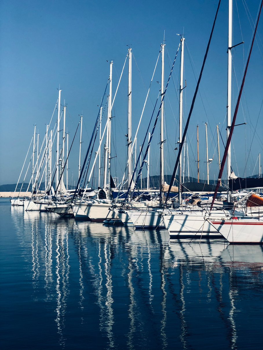 White Sailboats Docked on a Harbour 